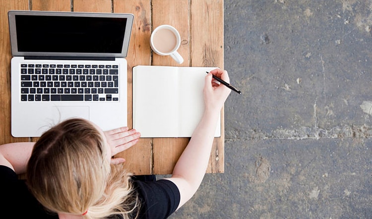 woman working at laptop computer