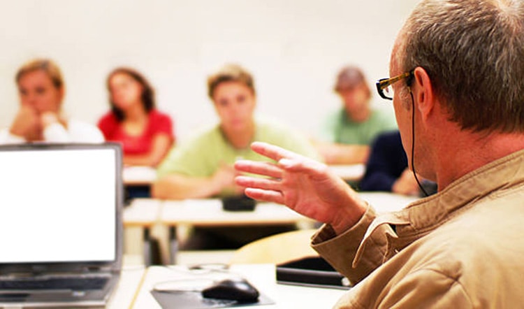 educator talking to students