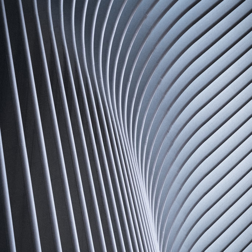 An abstract image of gray slats in a curved line.